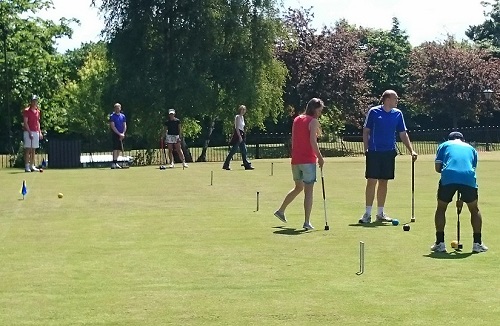 Group Croquet on a Sunny Afternoon
